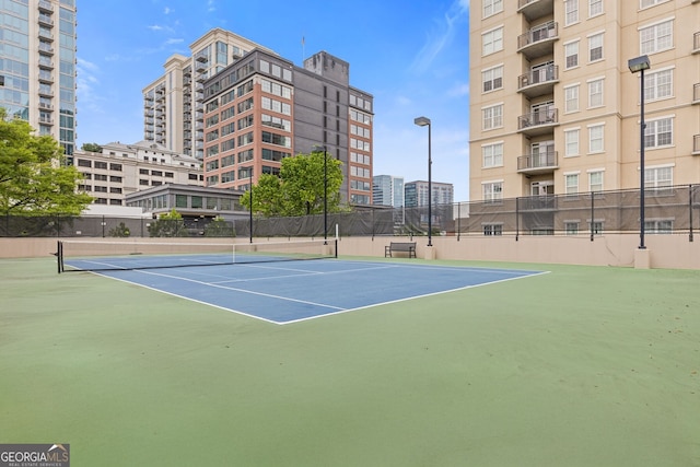 view of sport court featuring community basketball court and fence
