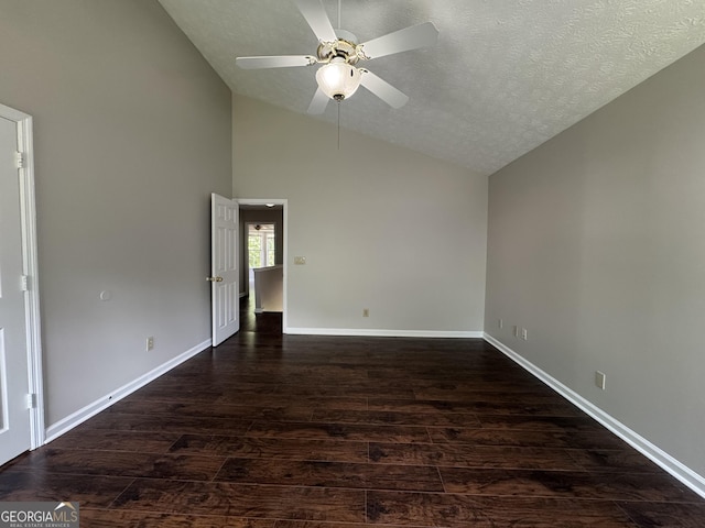 empty room with dark wood-type flooring, a ceiling fan, baseboards, and a textured ceiling