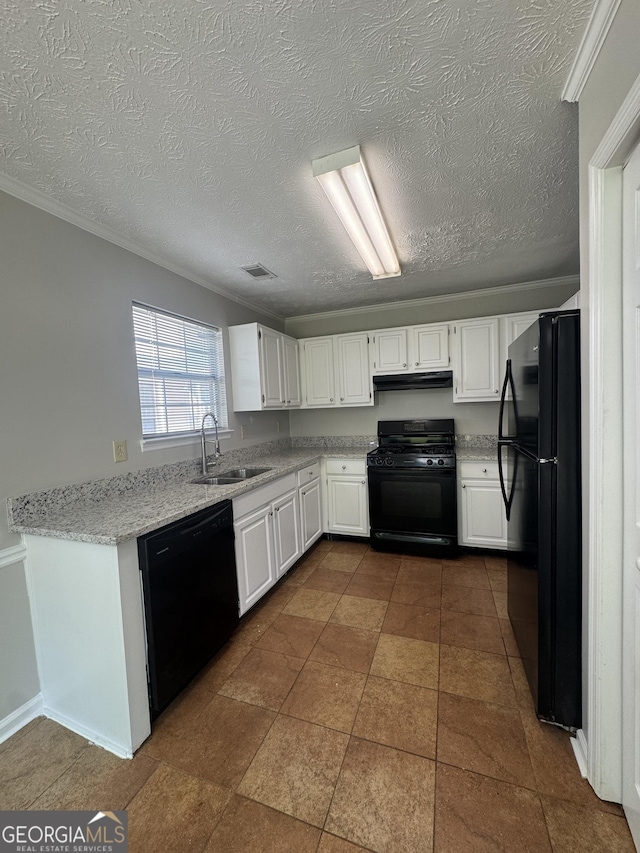 kitchen featuring under cabinet range hood, white cabinetry, a sink, and black appliances