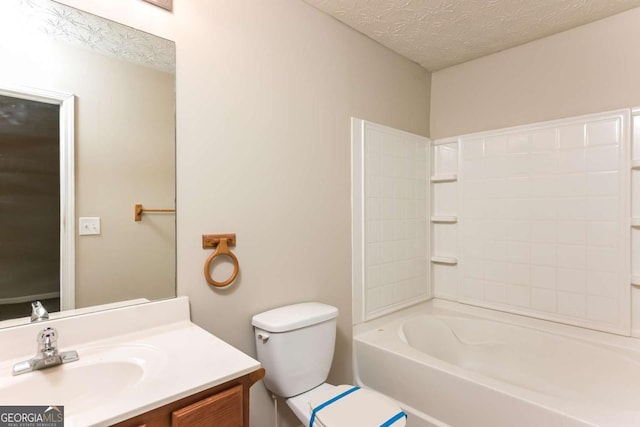 full bathroom featuring vanity, a textured ceiling, and toilet