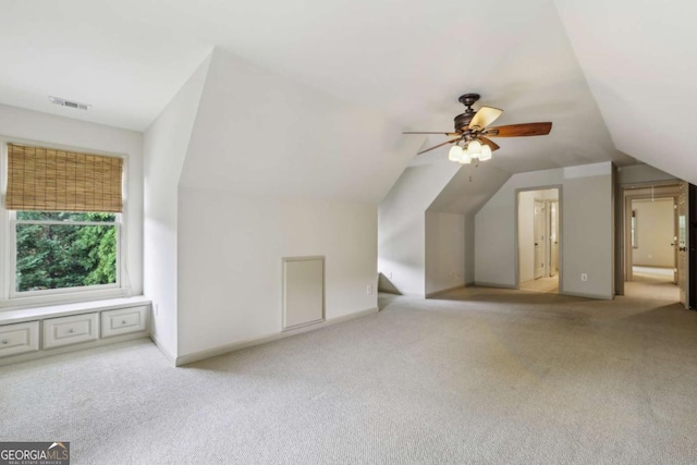 9075 Preston Ln, Suwanee, GA 30024 - additional living space featuring light carpet, vaulted ceiling, and a ceiling fan