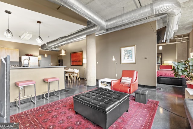 living room featuring finished concrete floors