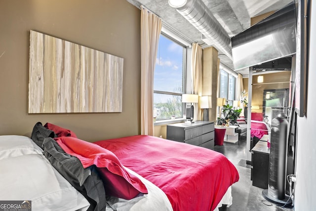 bedroom with finished concrete floors