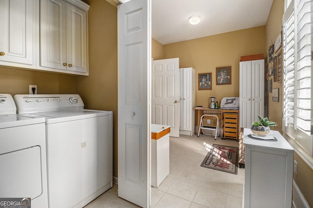 laundry room with light tile patterned floors and separate washer and dryer