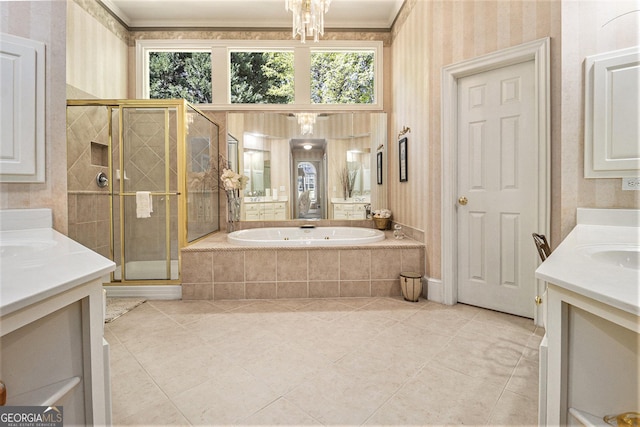 bathroom featuring a bath, a stall shower, two vanities, tile patterned floors, and wallpapered walls