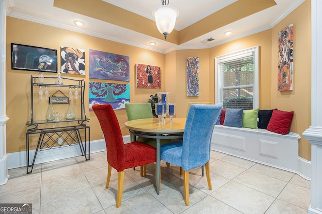 dining space with visible vents, crown molding, and light tile patterned floors