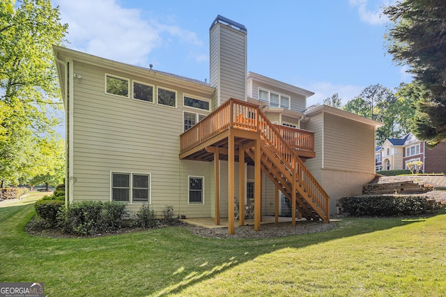 rear view of house with a chimney, stairs, a yard, and a deck