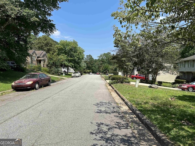 view of road featuring curbs