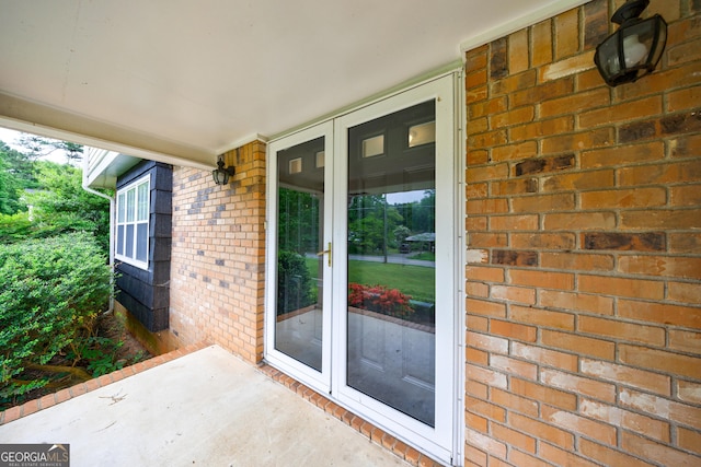 entrance to property with brick siding