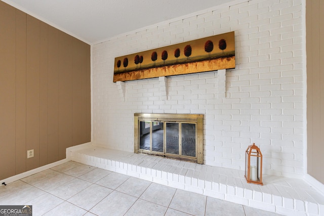 interior details with baseboards, ornamental molding, a brick fireplace, and wood walls