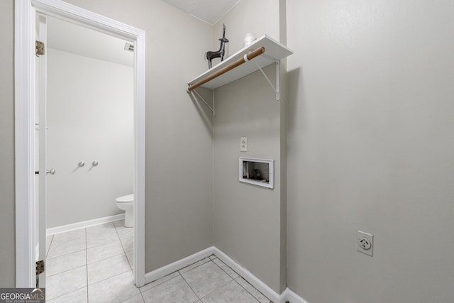 washroom featuring washer hookup, laundry area, electric dryer hookup, light tile patterned floors, and baseboards