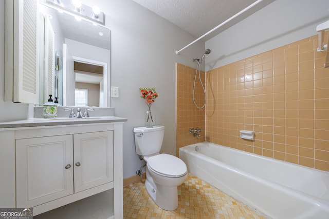 bathroom featuring vanity, tile patterned flooring, bathing tub / shower combination, toilet, and baseboards
