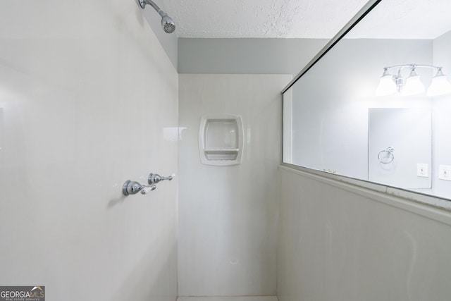 bathroom featuring a textured ceiling