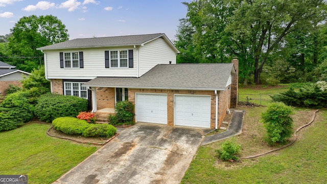 traditional-style home with fence, brick siding, a garage, a chimney, and driveway