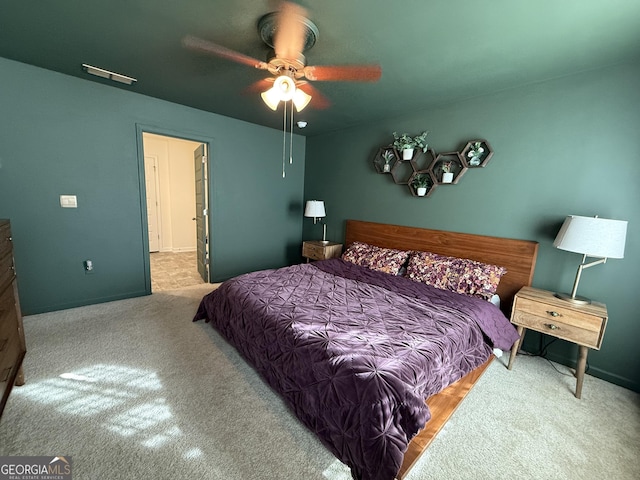 carpeted bedroom with baseboards and a ceiling fan