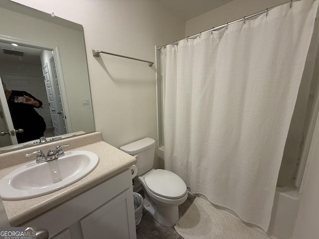 bathroom with vanity, shower / bath combo with shower curtain, toilet, and visible vents
