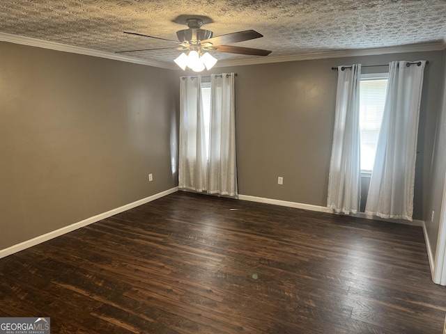spare room featuring baseboards, a ceiling fan, dark wood finished floors, and crown molding