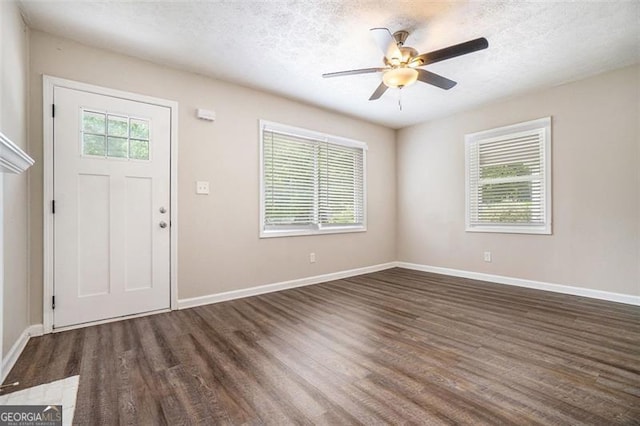 4004 Knightsbridge Rd, Kennesaw, GA 30144 - foyer featuring dark wood-type flooring, a textured ceiling, baseboards, and ceiling fan