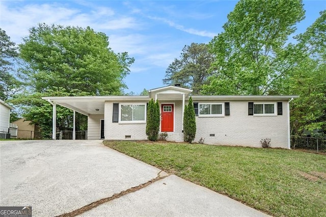 4004 Knightsbridge Rd, Kennesaw, GA 30144 - view of front facade featuring fence, brick siding, crawl space, a front yard, and driveway