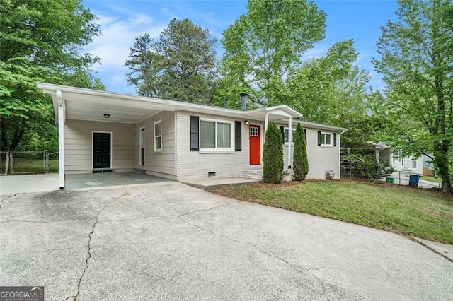 4004 Knightsbridge Rd, Kennesaw, GA 30144 - ranch-style home with a front lawn, brick siding, an attached carport, crawl space, and concrete driveway