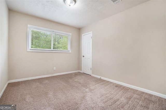 4004 Knightsbridge Rd, Kennesaw, GA 30144 - carpeted empty room with baseboards, a textured ceiling, and visible vents
