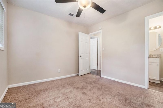 4004 Knightsbridge Rd, Kennesaw, GA 30144 - unfurnished bedroom with a ceiling fan, visible vents, baseboards, ensuite bathroom, and carpet