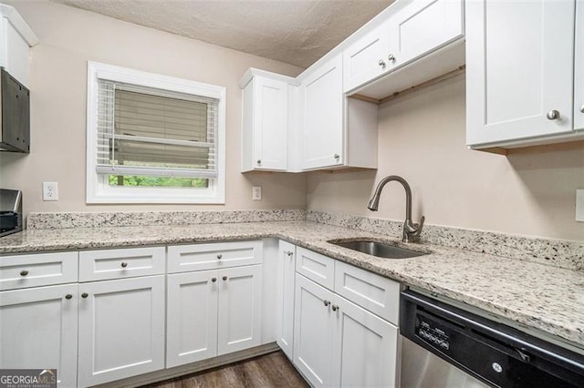 4004 Knightsbridge Rd, Kennesaw, GA 30144 - kitchen with dark wood-type flooring, white cabinetry, light stone counters, a sink, and dishwasher