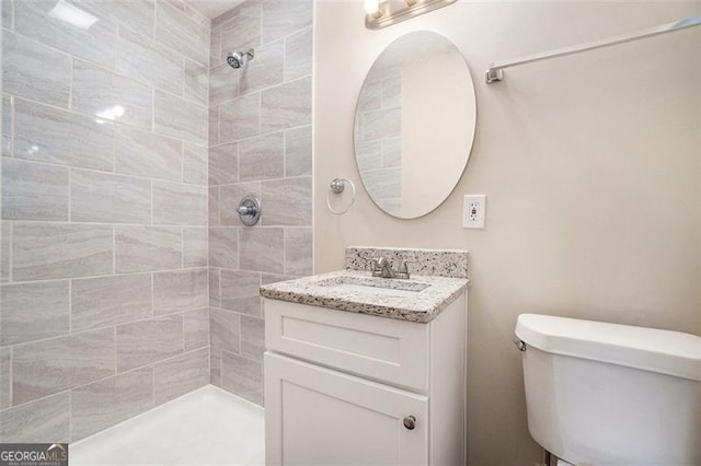 4004 Knightsbridge Rd, Kennesaw, GA 30144 - bathroom featuring vanity, a tile shower, and toilet