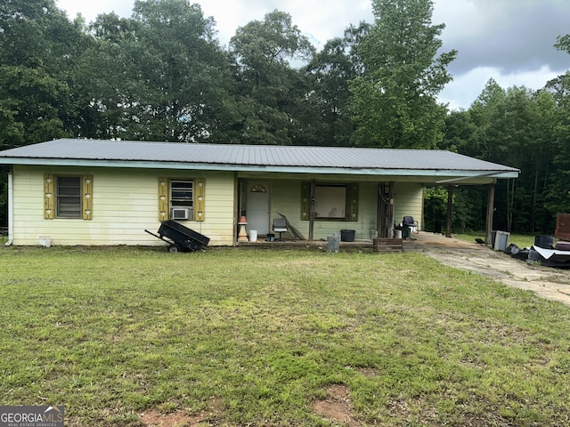 415 Gray Rd, Carrollton, GA 30116 - view of front facade featuring covered porch, metal roof, a front lawn, and an attached carport