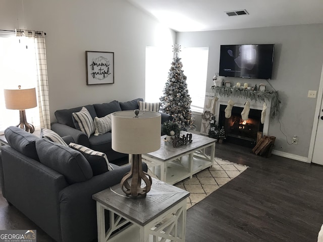 1047 Plantation Way NW, Kennesaw, GA 30144 - living area with wood finished floors, a lit fireplace, and baseboards