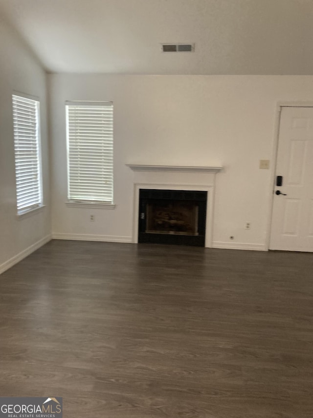 1047 Plantation Way NW, Kennesaw, GA 30144 - unfurnished living room with dark wood-style floors, a fireplace, and baseboards