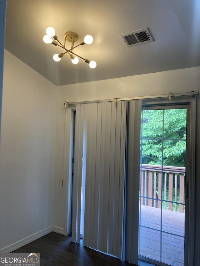 1047 Plantation Way NW, Kennesaw, GA 30144 - unfurnished room with a chandelier, baseboards, and dark wood-style floors