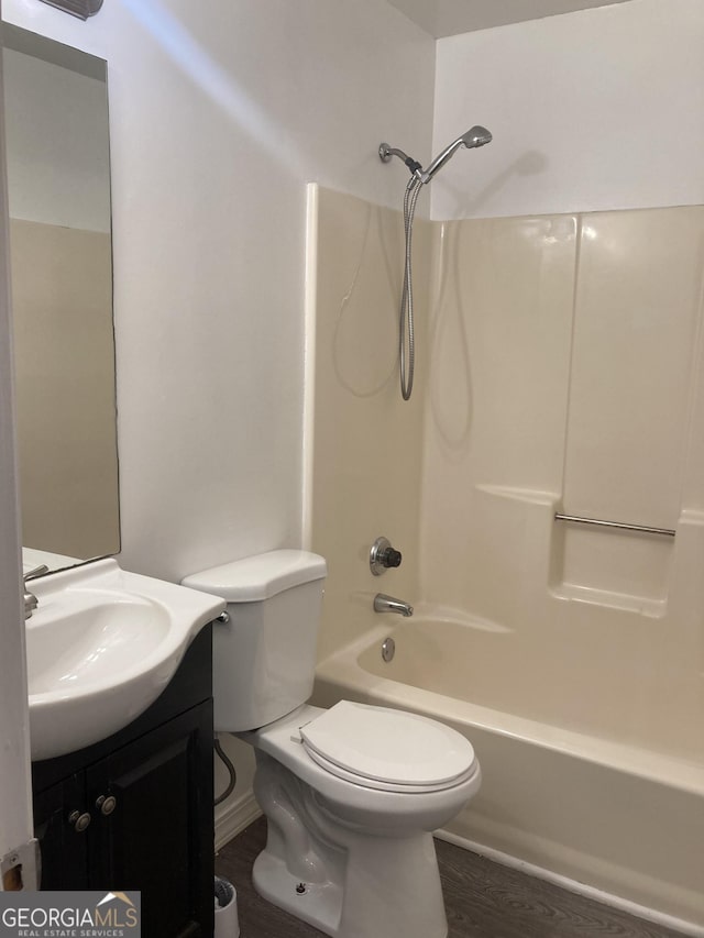 1047 Plantation Way NW, Kennesaw, GA 30144 - full bath featuring bathtub / shower combination, toilet, vanity, and wood finished floors