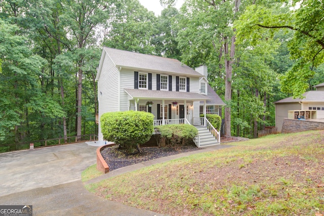 3480 Stillridge Dr, Alpharetta, GA 30022 - view of front of property featuring a porch, a chimney, view of wooded area, and fence