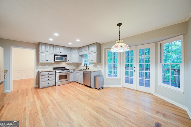 3480 Stillridge Dr, Alpharetta, GA 30022 - kitchen featuring appliances with stainless steel finishes, a sink, light wood-style flooring, healthy amount of natural light, and recessed lighting