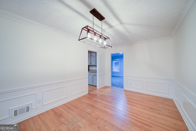 3480 Stillridge Dr, Alpharetta, GA 30022 - unfurnished room with light wood-style flooring, ornamental molding, a wainscoted wall, and a decorative wall