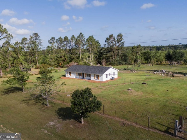 birds eye view of property with a rural view and a wooded view
