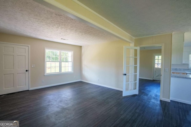 interior space featuring baseboards, a textured ceiling, dark wood-style floors, and french doors
