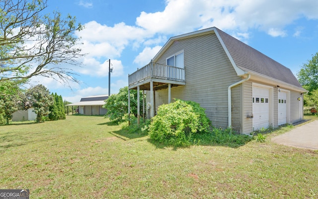 view of property exterior featuring a yard and roof with shingles
