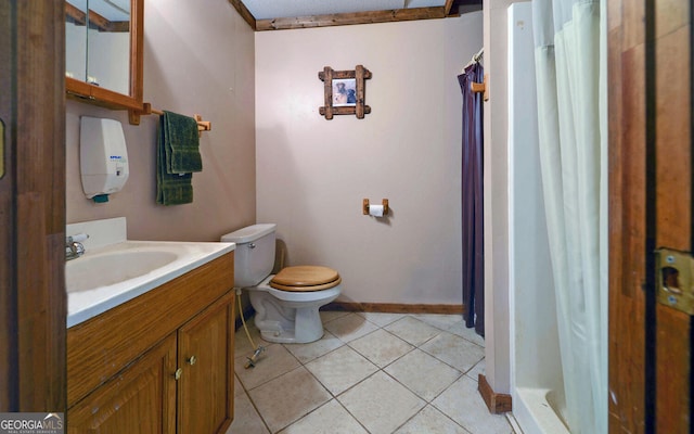 bathroom with tile patterned flooring, vanity, toilet, baseboards, and curtained shower