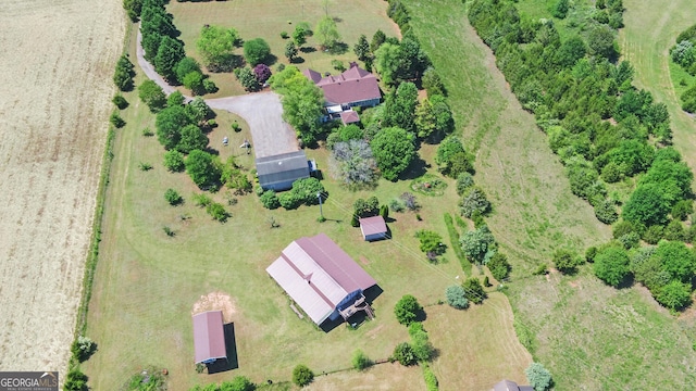 birds eye view of property with a rural view