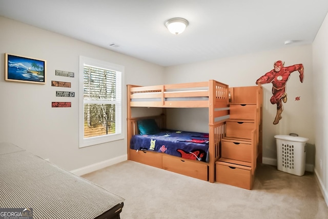 bedroom with carpet floors and baseboards