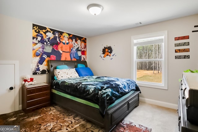 bedroom featuring baseboards, carpet flooring, and visible vents