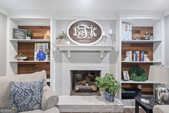 living room featuring crown molding and wood finished floors