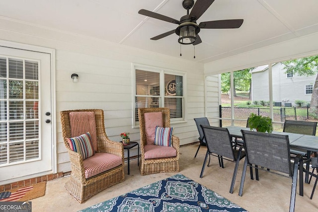 view of patio / terrace featuring fence, outdoor dining area, and ceiling fan