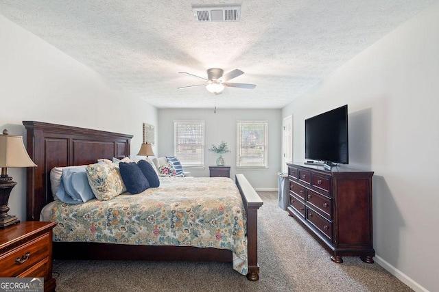 bedroom with visible vents, baseboards, and light carpet