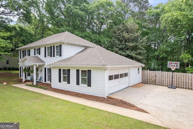view of front of house featuring a garage, fence, a front lawn, concrete driveway, and a shingled roof