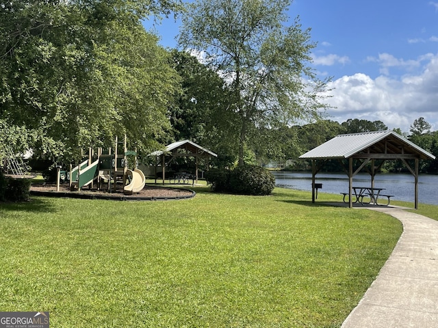 view of home's community featuring a gazebo, a water view, playground community, and a yard
