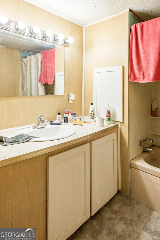bathroom with vanity and ornamental molding