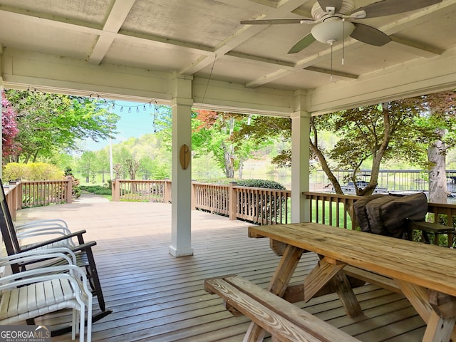 wooden deck with fence and ceiling fan